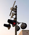 [The Sentinel] - railroad crossing, downtown, sunset